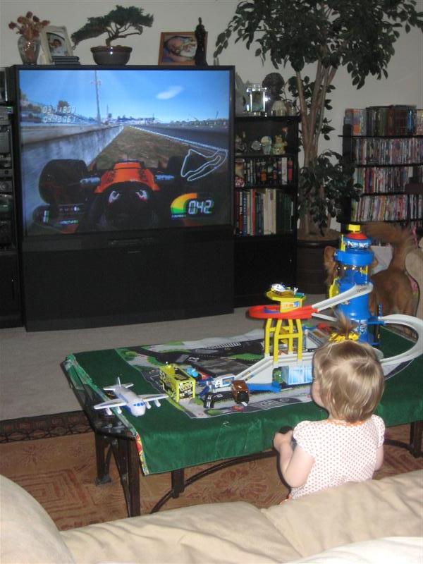 Jess-F1WithBigBro-2.JPG - Sweet!  I'm driving a Formula 1 car!  Video Games Rule!!!...