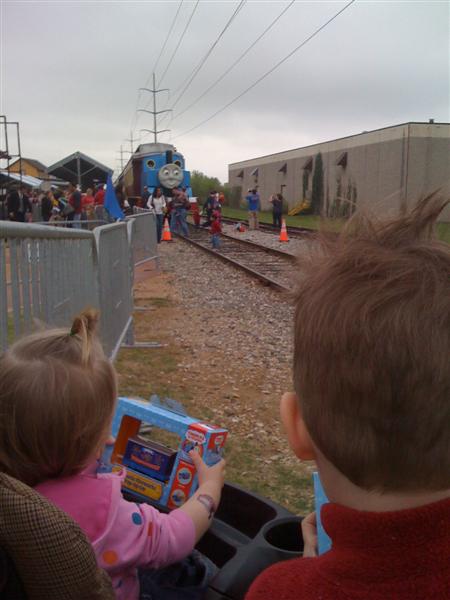 Jess_Wait4Thomas.jpg - My big brother and I checking out Thomas before we leave!  He's pretty cool!...
